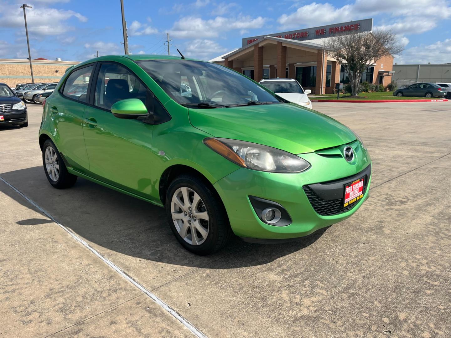 2013 green /black Mazda MAZDA2 Touring (JM1DE1LY1D0) with an 1.5L L4 DOHC 16V engine, Automatic transmission, located at 14700 Tomball Parkway 249, Houston, TX, 77086, (281) 444-2200, 29.928619, -95.504074 - Photo#0